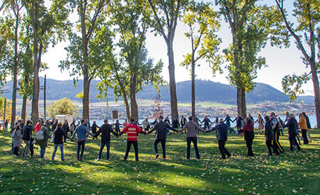 People holding hands in a circle